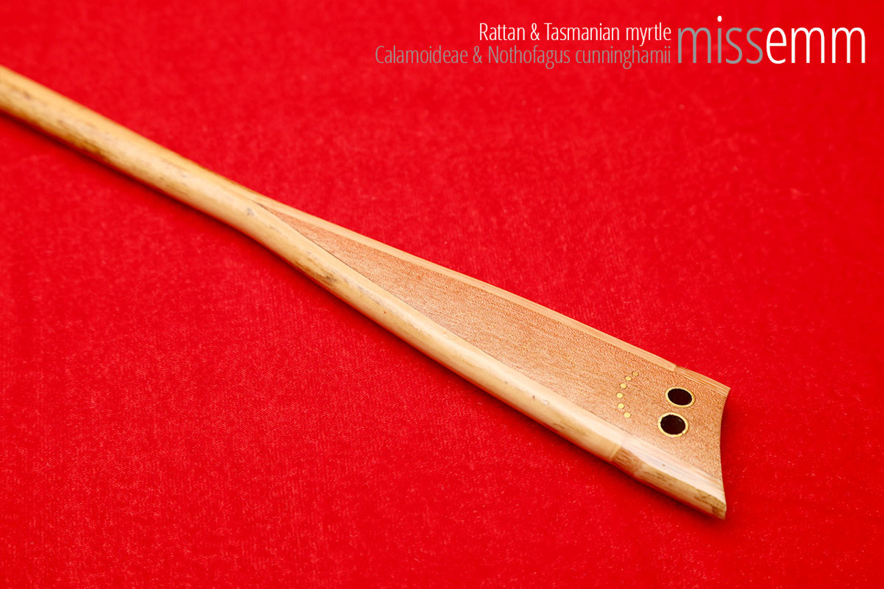 Handmade bdsm toys | Rattan cane | By kink artisan Miss Emm | The cane shaft is rattan cane and the handle has been handcrafted from myrtle with brass details.