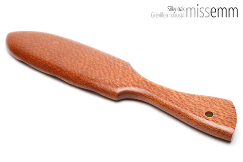 Unique handcrafted spanking toys | Wooden paddle | By kink artisan Miss Emm | Made from silky oak with brass details.