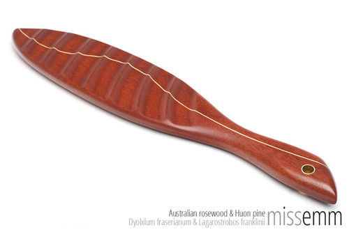 Unique spanking toys | Ridged wooden paddle | By fetish artisan Miss Emm | This stunning spanking paddle is made from Australian rosewood with a Huon pine line and brass details. It has a gently ridged face and a smooth face for adding an extra sensation to your impact play. 
