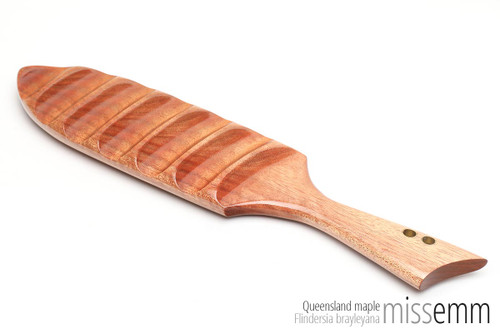 Handmade spanking toys | BDSM wooden paddle | Created by Australian kink artisan Miss Emm. This paddle is made from Queensland maple with brass details. It features a smooth face and ridged face which allows for two very different sensations. If you love unique fetish toys then this spanking paddle will be right at home in your fetish toy box.