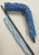 MICROFIBER DUSTING TOOL. Kit includes bendable 24"x5” frame with handle, 24”x5” blue microfiber tube duster sleeve, 28”- 48" extending handle, and 24” smooth replacement microfiber sleeve
