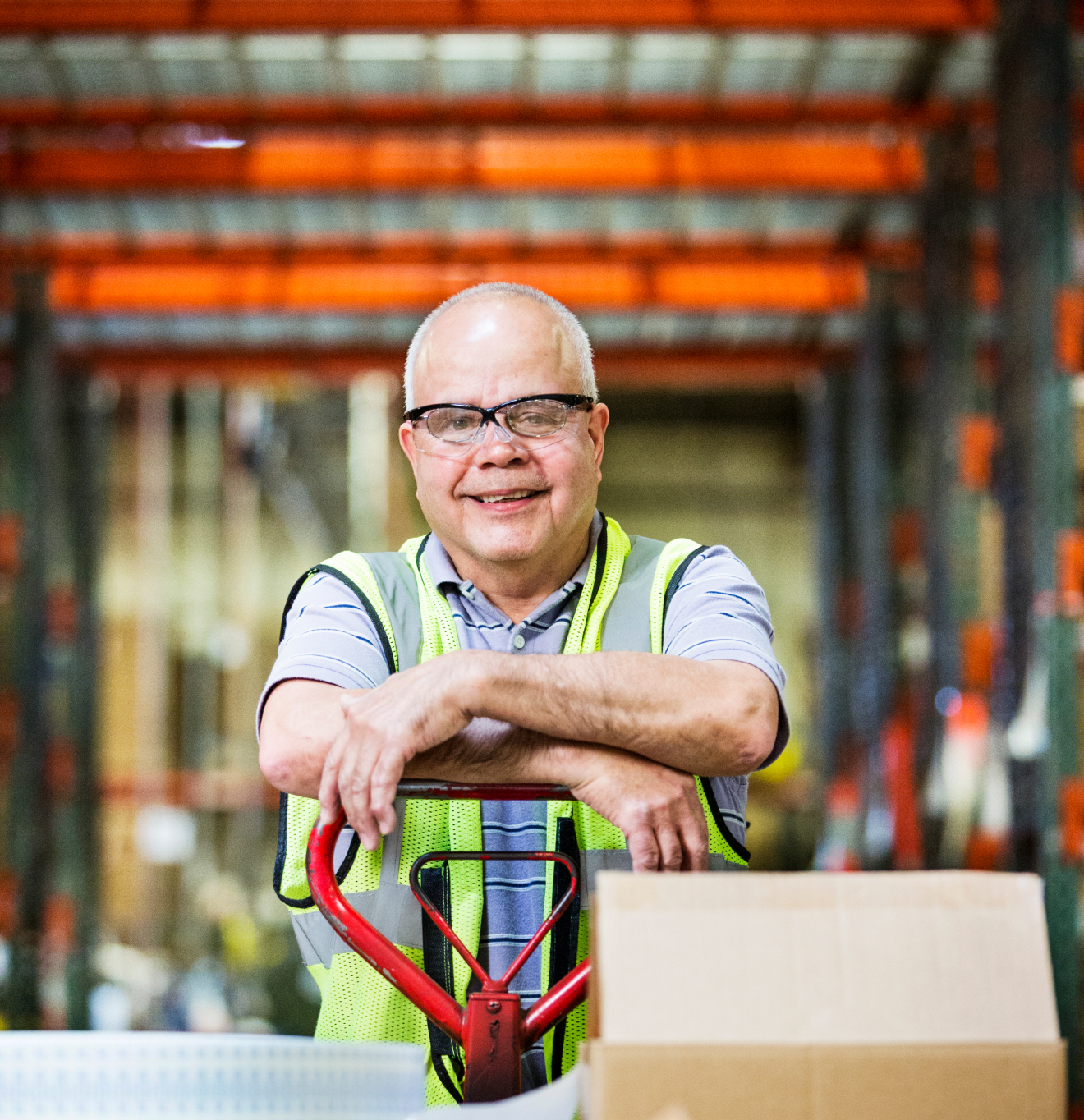 man in a warehouse wearing goggles