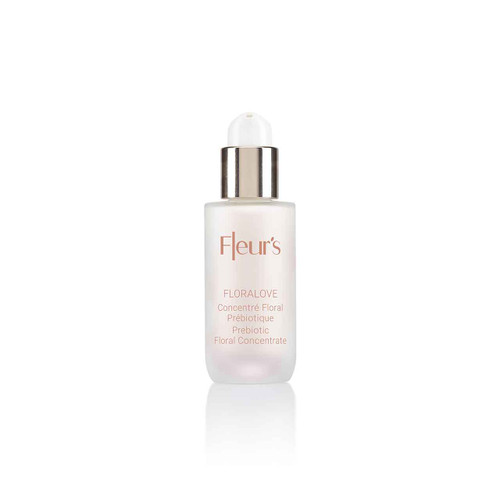 A clear glass bottle with a silver cap, labeled "Fleur's Floralove Prebiotic Floral Concentrate."