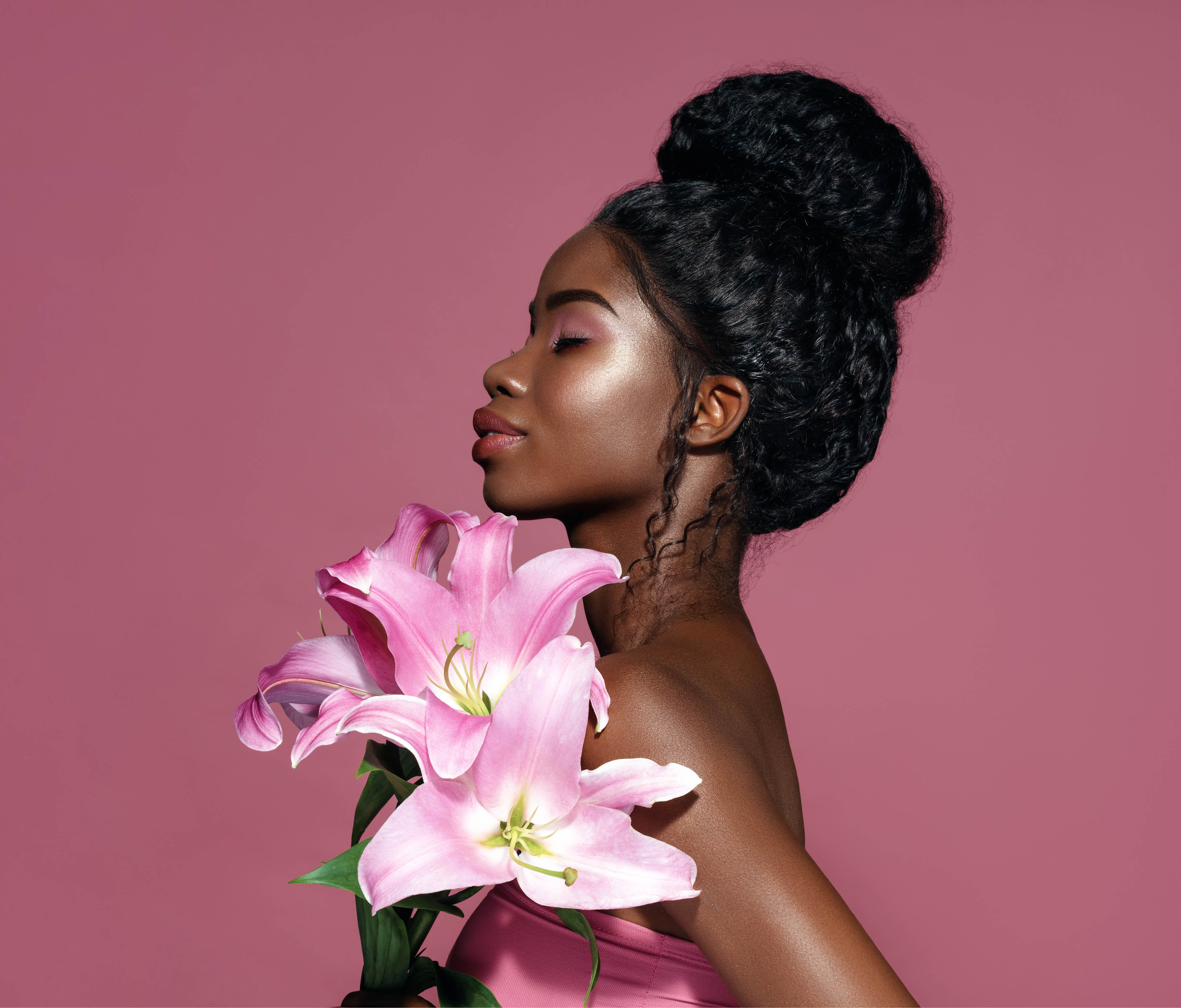 A woman holding lilies.
