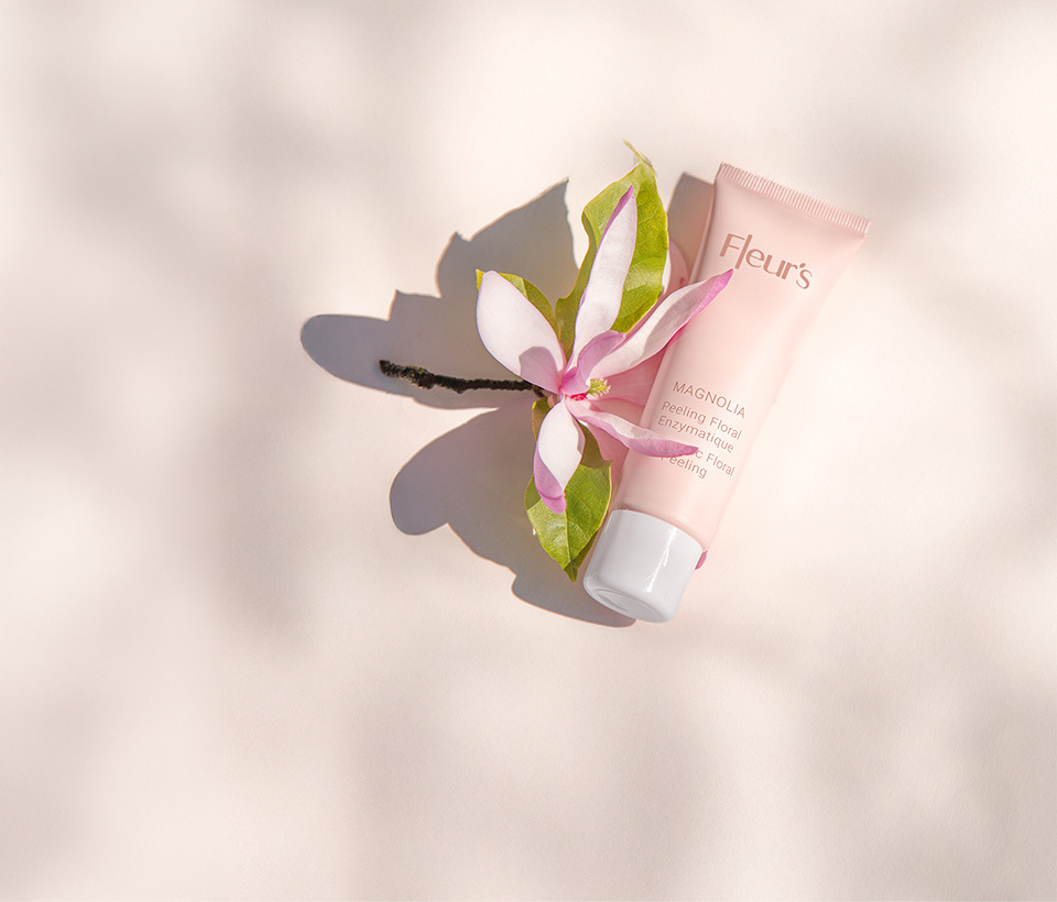 Magnolia Enzymatic Floral Peel, next to a magnolia flower.