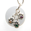 Silver plated chain collar with silver plated charms.
Three dangle paws with Swarovski rhinestones on white pearl acrylic disk.
