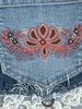 Lace and Embroidery Pocket Harness Vest Closeup