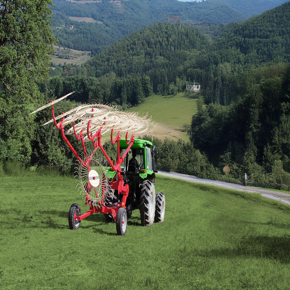 Farm-Maxx FGCR-10 10-Wheel Hydraulic Fold Carted Hay Rake working in large hay field