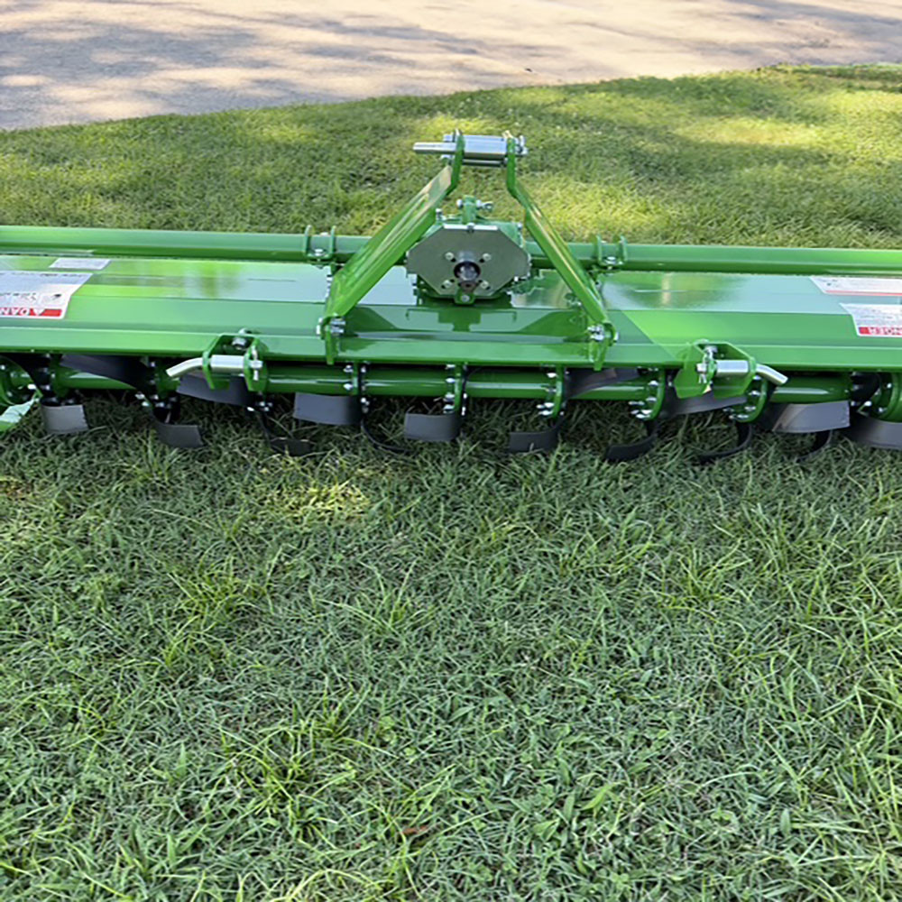 Rear view of Sicma S673 rotary tiller showing gearbox, PTO driveline, and three-point hitch frame