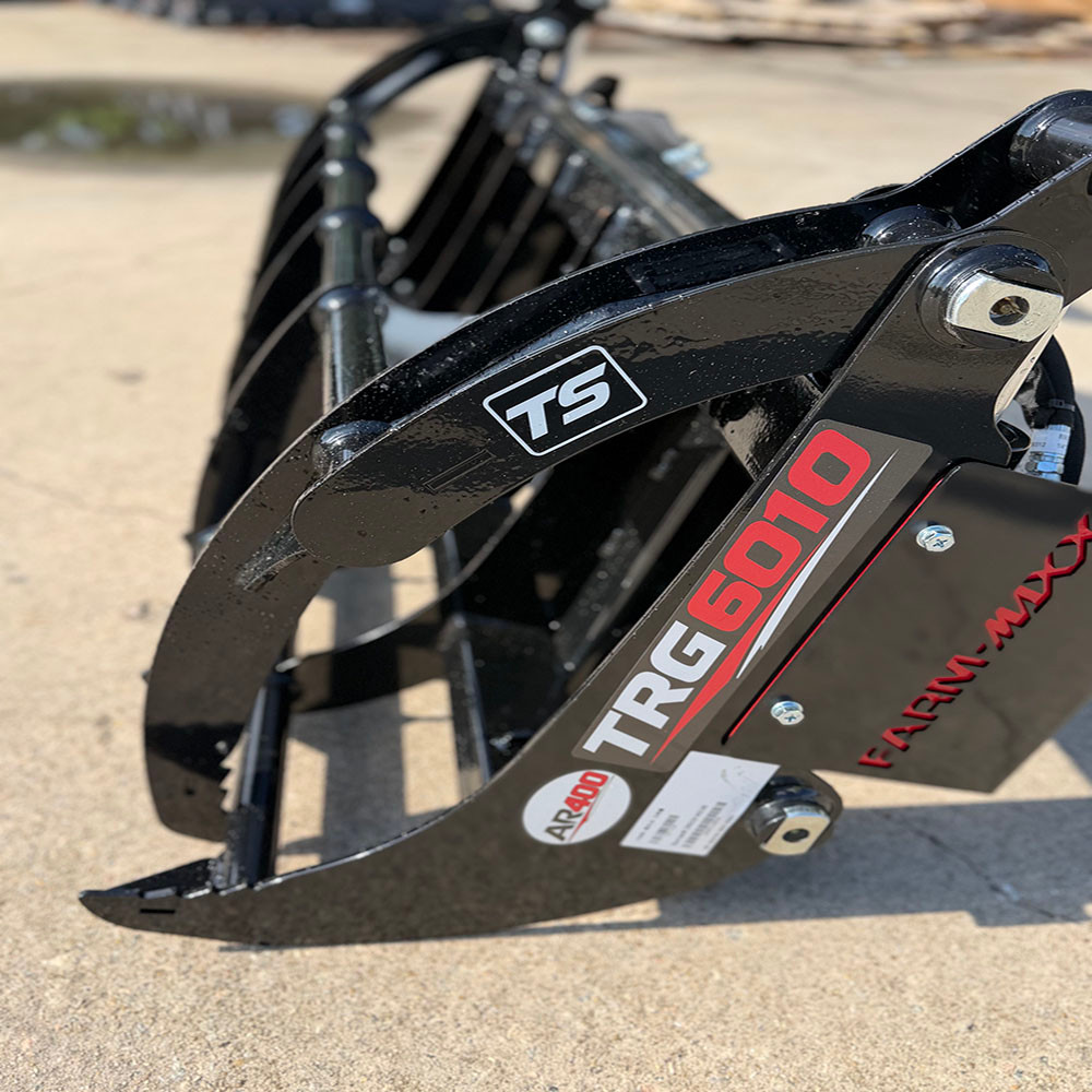 Close-up of reinforced rake grapple tines designed for brush, limbs, logs, and vegetation cleanup