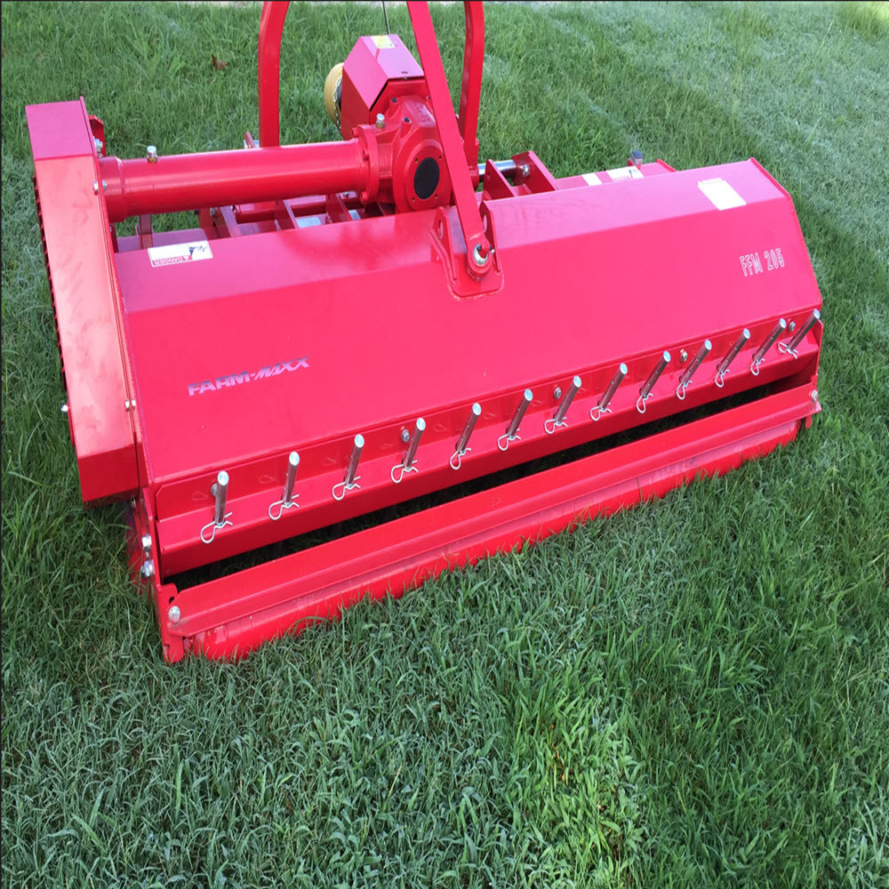 79" Farm-Maxx 3-Point Tractor Heavy Duty Flail Mower Model FFM-205
Mechanical Shift, W/Hammers, Rack Cover, Roller, Skids

The Farm-Maxx Flail Mower (FFM) was specifically designed to cut grass that is too heavy for ordinary mowers. It is ideal for providing a rough cut to taller grass where loose debris may be an issue, such as on roadsides.

The FFM’s design includes a rotating horizontal drum with sharp and durable flails. If a flail comes into contact with something solid, it will simply bounce off and bypass that particular object. In contrast, rotary mowers can grab small objects and eject them from the mower deck. This unique feature makes the FFM the perfect choice for areas where flying debris could cause damage.

In addition, it is also effective for managing weeds and preventing their unwanted growth. Another great use for it is mulching vineyards and orchard pruning. Its hydraulic feature allows it to reach areas of the ground where cutting grass is a challenge. The FFM is compatible with tractors ranging from 35 to 60 HP.

Standard Features:
79 inch working width
Rated for 30-60 HP
Manual side-shift included
26 - Hammer style blades included
Adjustable skid shoes included
Overrunning Driveline included
Series 5 PTO shaft included
Rear roller included
External setting of the belts
Rear rakers

*Some Assembly Required 
*Images are representative but may vary from actual product