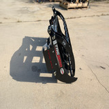 Side profile of Farm-Maxx TS rake grapple attachment for land clearing