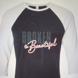 Broken to Beautiful on FRONT, This is Your Song! Isaiah 61:1-3 on back. Black with white sleeves Broken to Beautiful on FRONT, This is Your Song! Isaiah 61:1-3 on back. Black with white sleeves