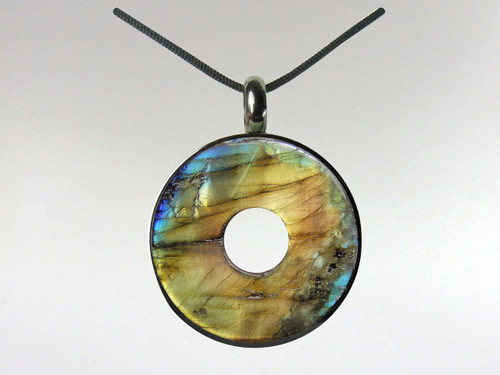 Labradorite donut pendant set in surgical quality stainless steel.