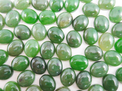 Jade Nephrite Cabochon 10x12mm with green hues.