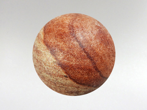 Stunning rainbow sandstone sphere with beautiful natural tones.