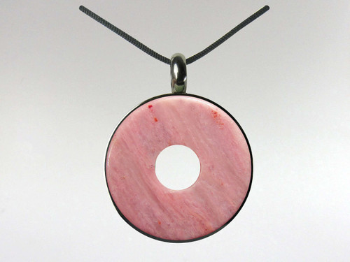 Rhodonite donut pendant set in surgical quality stainless steel.