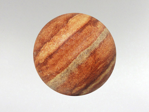 Amazing rainbow sandstone sphere with beautiful natural tones.