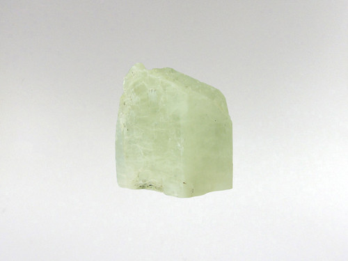 This opaque Hiddenite crystal fits elegantly in your palm