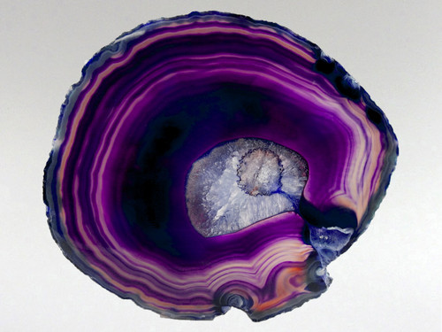 Stunning agate slice with a gorgeous purple hue.