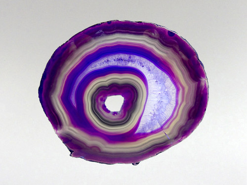 This agate slice has been photographed with light behind it to help emphasize its attributes.