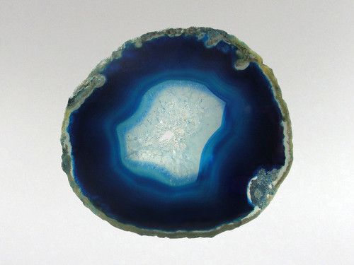 This agate slice has been photographed with light behind it to help emphasize its attributes.