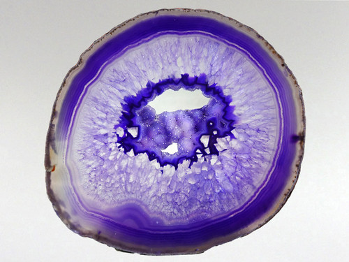 This agate slice has been photographed with light behind it to help emphasize its attributes.