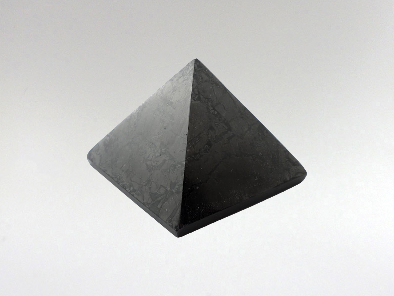 Why keep Shungite in your home? EMF Protection; these days there is a shower of Wi-Fi & electromagnetic frequencies disrupting the energetic field & negatively affecting cells in the body. This creates a feeling of being drained, exhausted & out of balance. Shungite is a powerful protector & has been shown to neutralize electromagnetic radiation. It should be kept in the areas of the home where most time is spent near electronics and internet modems. Having any form of shungite, particularly pyramid or spheres, is reputed to neutralize these frequencies and have a positive impact on health. Shungite has many curative properties & is used for many different reasons ... infuse, ground and stabilize. Water infused with low doses of shungite is said to assist children with hyperactive disorders, assisting to ground them & giving them internal peace. It acts as powerful antioxidant.