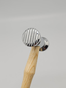 Hammer Texturing (narrow stripes/dimples). One side has narrow stripes for creating line texture designs. The other side has dimples for creating dimple texture designs.