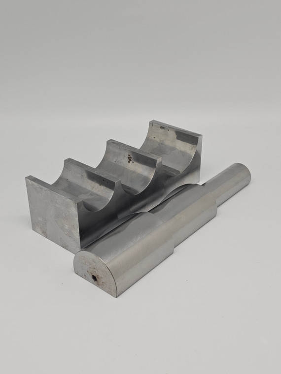 Forming Set 2 Pc (block and half mandrel).

A steel bending block and roller mandrel are essential tools for jewelry making, particularly for shaping and bending metal. The steel bending block has a flat surface and various curved shapes, making it suitable for bending metal into different shapes and forms. The roller mandrel, on the other hand, has a tapered shape and can be used for forming rings and other circular shapes.

These tools are ideal for working with metal and can help you create a variety of jewelry designs. The steel bending block and roller mandrel can be used to create bangles, rings, and other metal jewelry pieces with intricate shapes and designs. They are especially useful for working with thicker gauges of metal.

One must-have jewelry making item to use alongside the steel bending block and roller mandrel is a forming mallet such as a Weighted Rawhide Mallet.