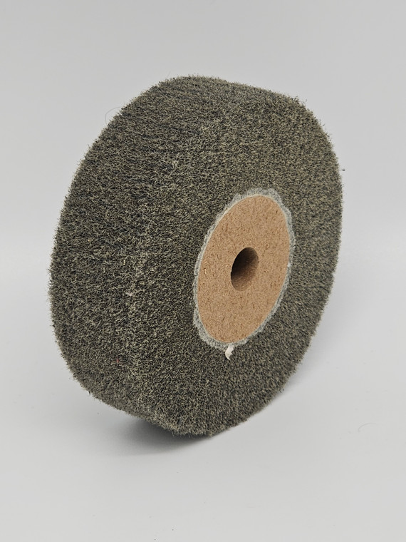 Satin Finish Wheel X-Fine 4"

A Satin Finish Wheel X-Fine 4" is a specialized type of abrasive tool used in jewelry making to achieve a soft, matte finish on metal surfaces. It is made of a fine abrasive material that is able to create a textured surface on metal when used with a rotary tool or bench grinder.

The best use for a Satin Finish Wheel X-Fine 4" in jewelry making is in creating a matte finish on metal without removing too much material. It is especially effective for creating a uniform, satin finish on larger metal surfaces such as bangles or pendants.

One unique use for a Satin Finish Wheel X-Fine 4" in jewelry making is to add texture and depth to metal designs. By using the wheel to create a fine, uniform texture on the surface of the metal, it can give the piece a more dynamic and interesting appearance.

A must-have jewelry making item to use alongside a Satin Finish Wheel X-Fine 4" is a protective mask or respirator. As with all abrasive tools, the fine particles generated by the wheel can be hazardous if inhaled, so it is important to take proper safety precautions.