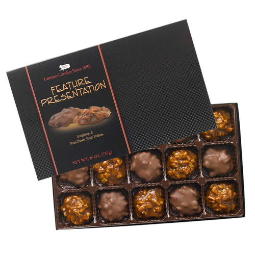 Lammes Candies' Feature Presentation box features a beautifully arranged tray of Texas Chewie Pecan Pralines and chocolate-coated pecan caramel clusters, highlighting the indulgent Pralines and Pecan Chocolate Caramel Combination.