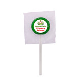A green lollipop with a white stick, wrapped in clear plastic, featuring a logo on the wrapper.
