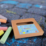 A box of Sketch Pavement Chalk in various colors, with a whimsical design on the front, placed on a textured surface. A box of Sketch Pavement Chalk in various colors, with a whimsical design on the front, placed on a textured surface.