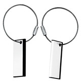 A pair of metal cable tags with a black border and a reflective surface, designed for labelling or identification.