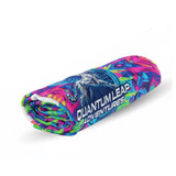A rolled beach towel featuring vibrant pink, green, and blue colours with a logo.