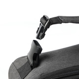 A close-up of a black cooler bag featuring a buckle strap and zipper. The bag has a sleek, modern design.