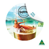A circular coaster featuring a cocktail with a prawn and a beach background, predominantly in turquoise and orange.