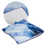 A large, blue and white printed cloth with a textured white border and a logo in one corner.
