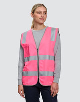 A pink high-visibility safety vest with reflective stripes and utility pockets, worn by a model.