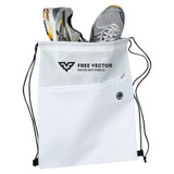 A white drawstring bag containing a pair of grey and yellow sports shoes, featuring a logo and a zip pocket.
