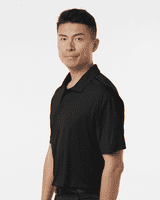 A black men's polo shirt with a collar displayed on a model, featuring a logo on the upper left side.