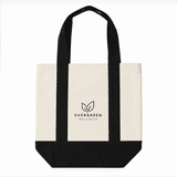 A mini canvas tote in cream and black with handles and a logo on the front.