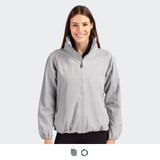 A full zip women's jacket in light grey, featuring a high collar and elasticated hem. It has a logo on the chest.