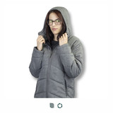 A grey puffer jacket with a hood, featuring a zipped front and side pockets. The model is wearing glasses.