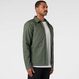 A green service jacket with a collar, featuring a side pocket and a minimalist design.