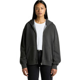 A woman wearing a faded dark grey zip hoodie, featuring a front pocket and a logo.