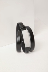 A black leather belt with a sleek metal buckle, featuring a minimalist design and smooth finish.
