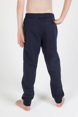 Navy track pants with an elastic waistband and a back pocket, shown from the back on a bare-footed child.