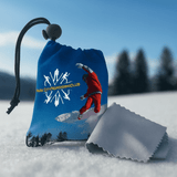 A blue microfibre pouch with a skiing graphic, containing a grey cleaning cloth. The pouch has a logo on it. A blue microfibre pouch with a skiing graphic, containing a grey cleaning cloth. The pouch has a logo on it.